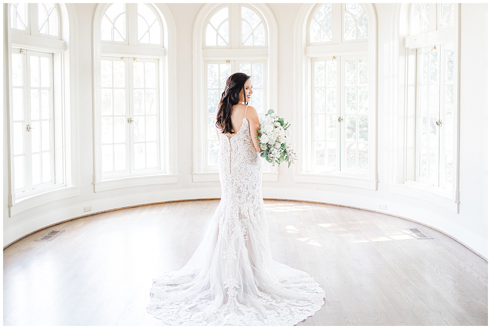 Bride holding white bridal bouquet in oval room at Mansion at Woodward Park Tulsa bridal session