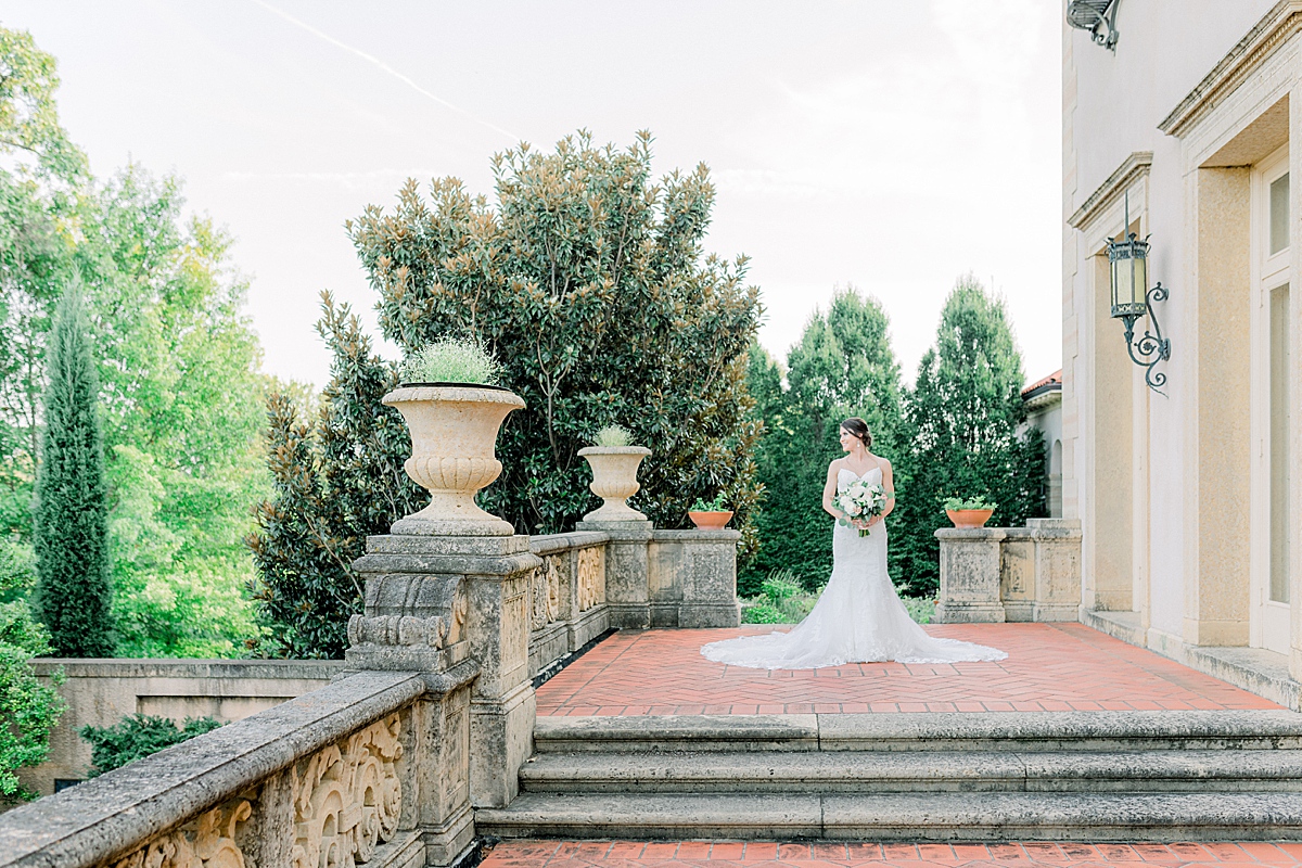 Bride standing holding bouquet at Tulsa Philbrook