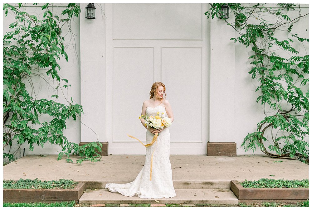 Bride standing in front of ivy wall at Willow Creek Mansion